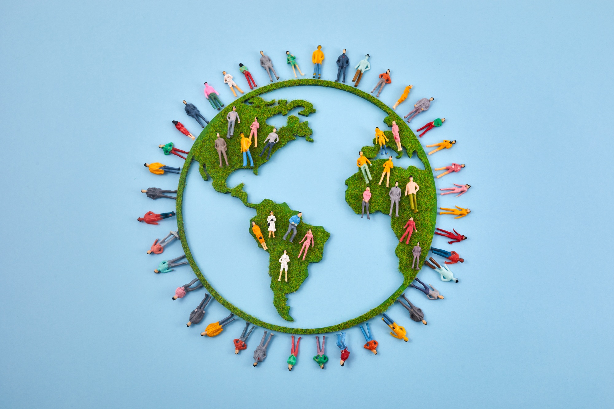 World Population Day, creative concept. Large and diverse group of people in the shape of the world